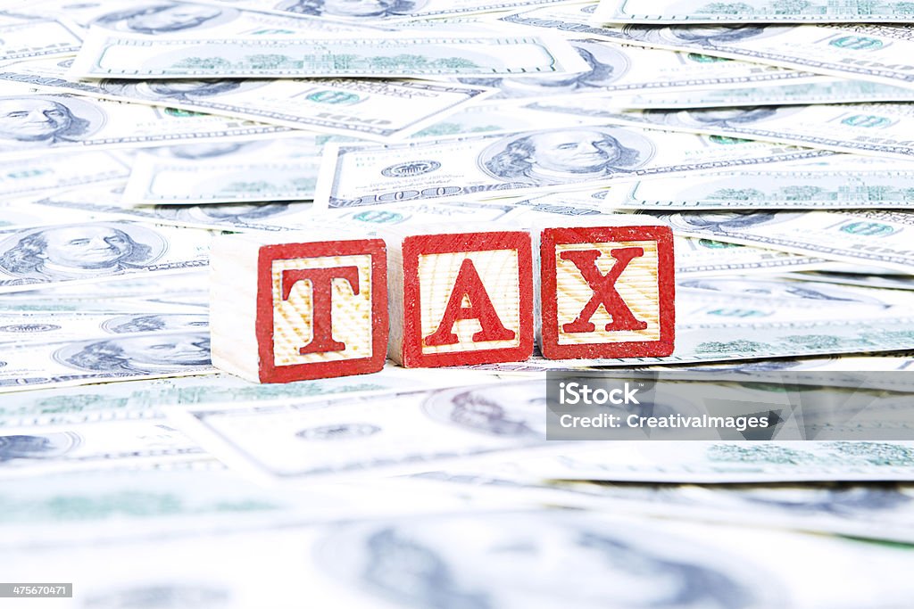 Tax word with money Tax word with money american dollars Banking Stock Photo