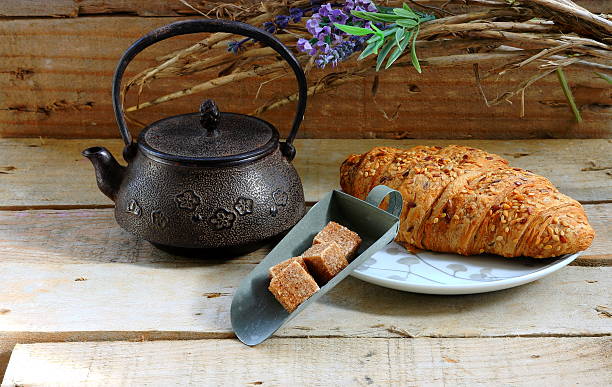 istock Teapot and croissant 475670777