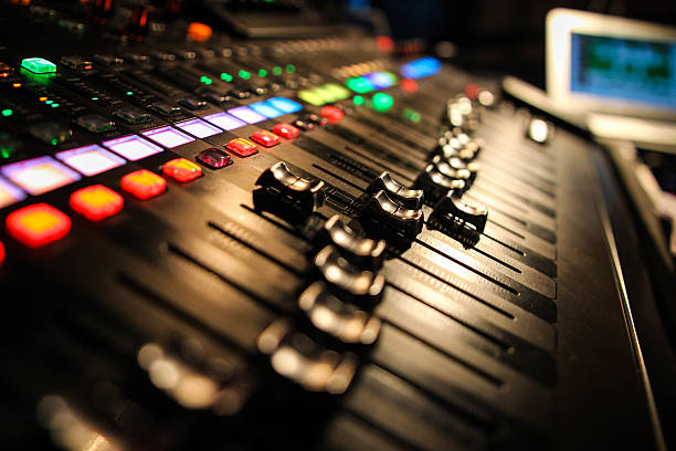 Live Mixing Desk Audio mixing desk in use bass instrument photos stock pictures, royalty-free photos & images