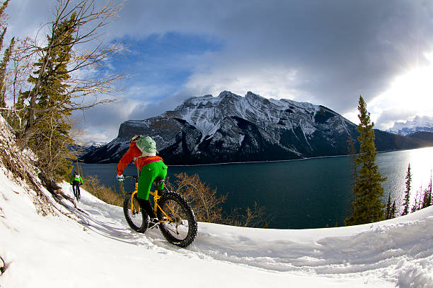 istock Winter Snow Biking Couple 475680433