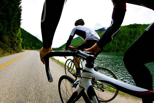 road bike riders - racing bicycle fotografías e imágenes de stock