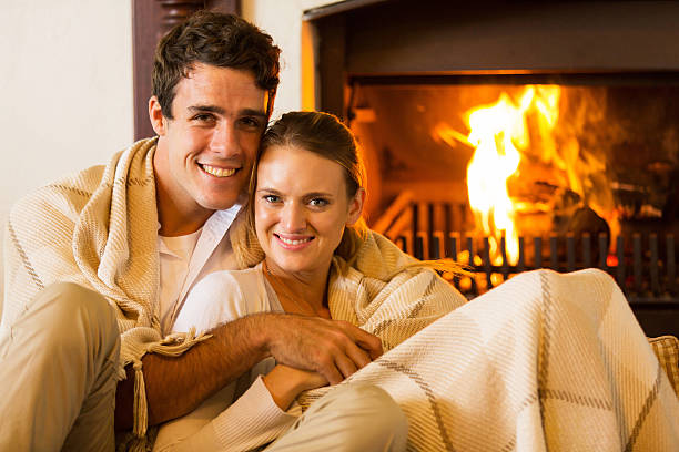 istock couple relaxing on the couch 475681940