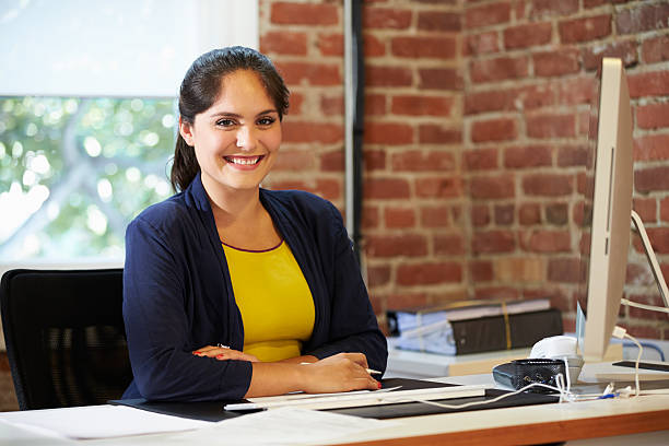 istock Woman Working At Computer In Contemporary Office 475684259