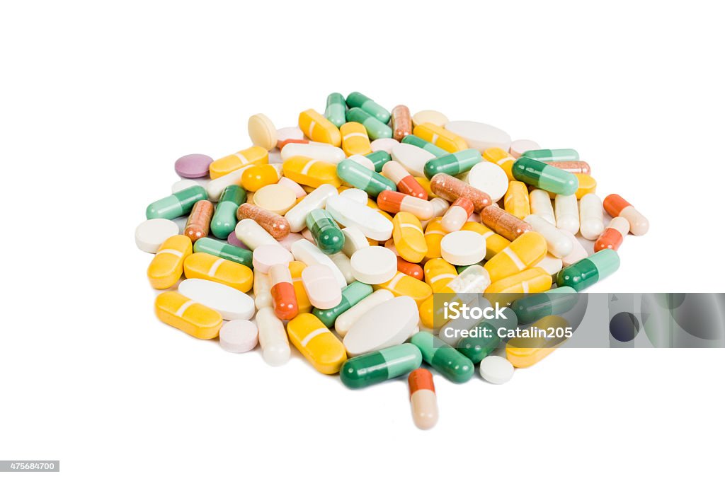 Group of many colored pills isolated Group of many colored pills isolated on studio white background 2015 Stock Photo