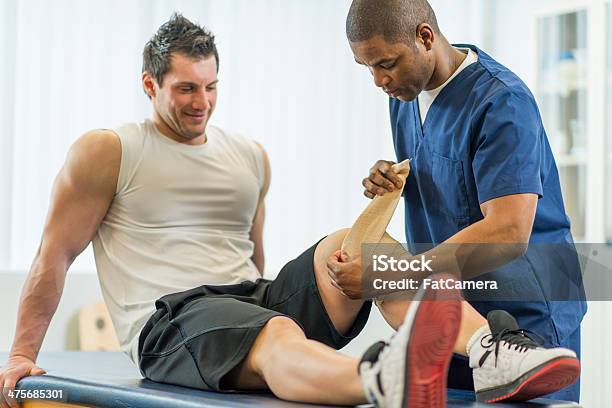 Physical Therapy Stock Photo - Download Image Now - Athlete, Bandage, Doctor