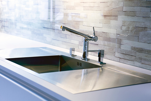 close-up of modern stainless steel kitchen sink