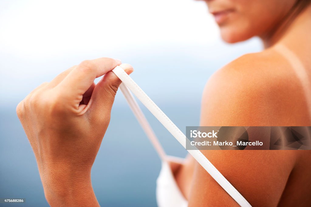 Black tanned body, light sunburn, bronze tan Sunbathing Stock Photo