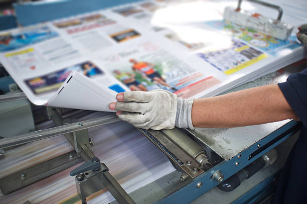 Post press finishing line machine post press finishing line machine: cutting, trimming, paperback and binding digital printing house stock pictures, royalty-free photos & images