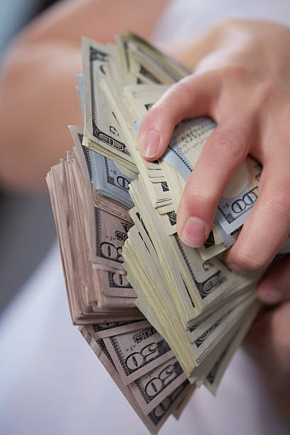 istock Money in female hands 475694940