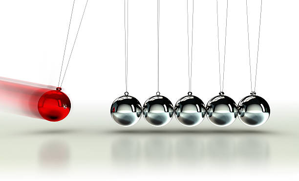Newton's Cradle with red ball stock photo