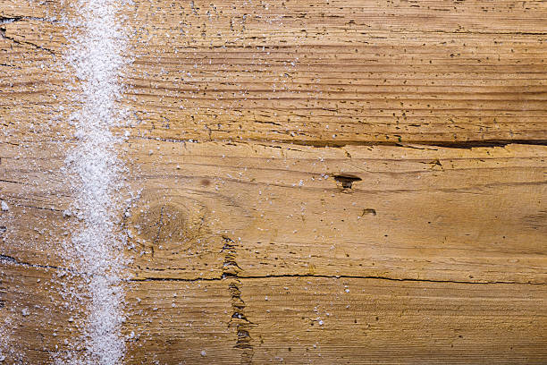 istock wooden background with snow 475697627