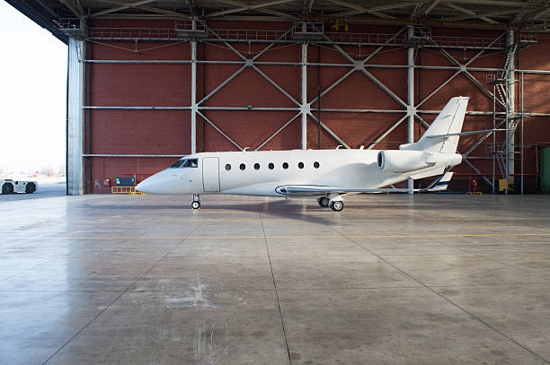 istock Business jet airplane is in hangar. 475698214
