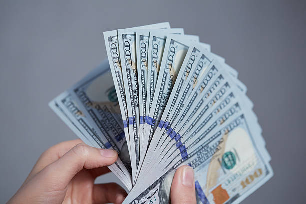 istock Money in female hands 475698986