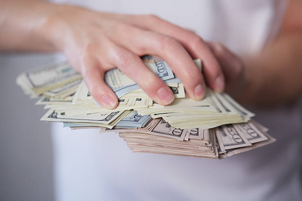 istock Money in female hands 475699202