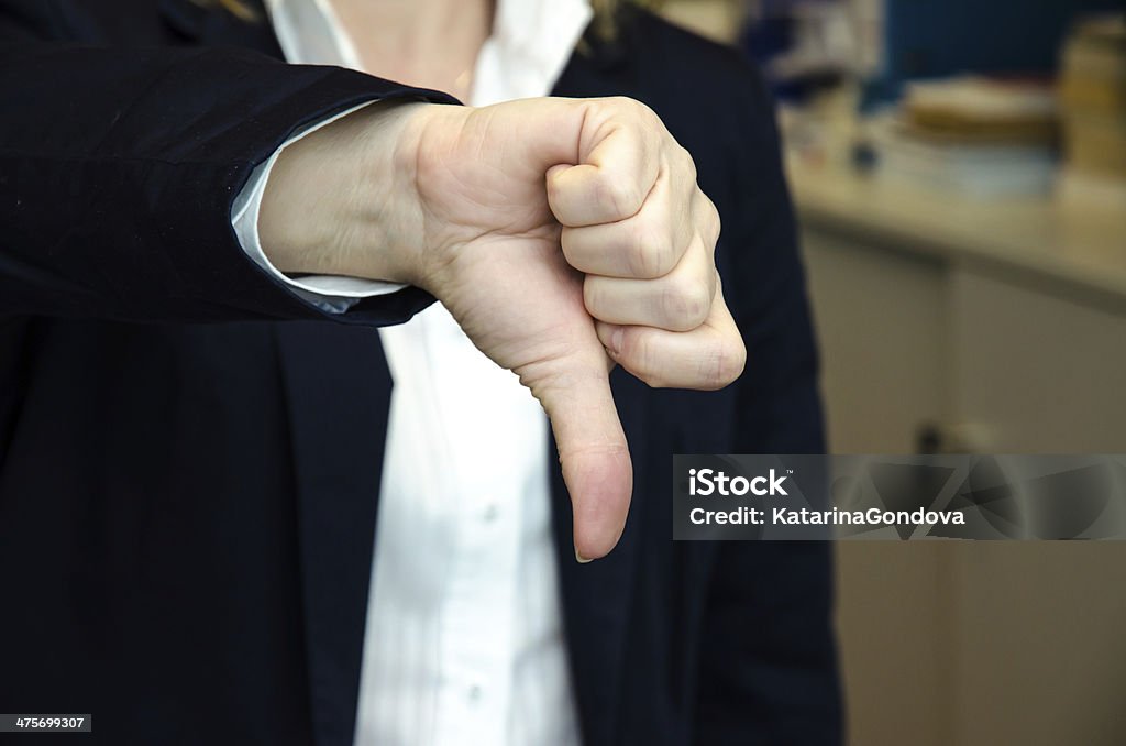 thumb down anonymous faceless person with thumb down gesture Adult Stock Photo