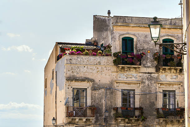 Old house facade with flowers