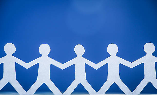 istock Group of people holding hands 475699442