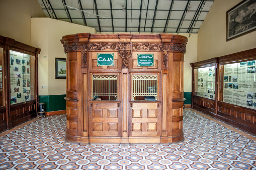 Lima, Peru - January 21, 2015: Vintage railway station ticket office in Lima park Parque de la Amistad. It has been placed in an ornate entrance hall