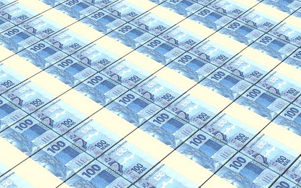 istock Brazilian reais bills stacks background. 475700274