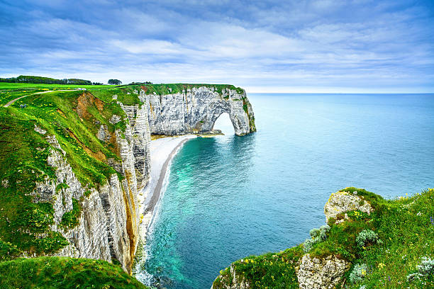 istock Etretat, Manneporte natural rock arch and its beach. Normandy, F 475702165