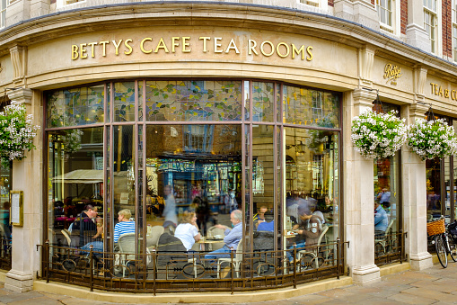 York, England - July 5, 2014: Betty's Cafe Tea Rooms, busy full of customers. At 6-8 St Helens Square, York, North Yorkshire.