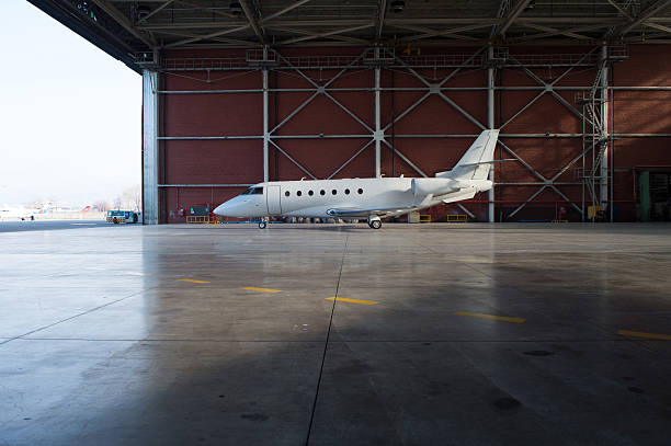 istock Business jet airplane is in hangar. 475702622