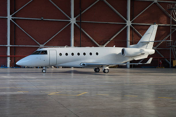 istock Business jet airplane is in hangar. 475702630