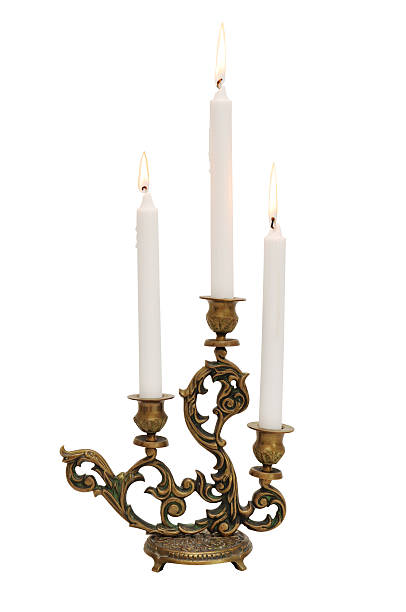 istock Antique candelabra with three melting candles isolated on white background 475703878
