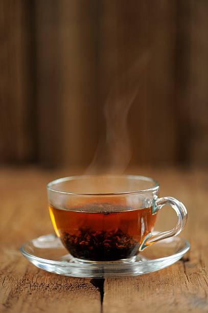 istock Shu puerh tea brewed steaming in glass cup 475705214