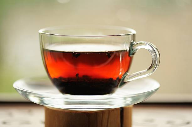 istock Ripe puerh tea brewed in glass cup 475705228