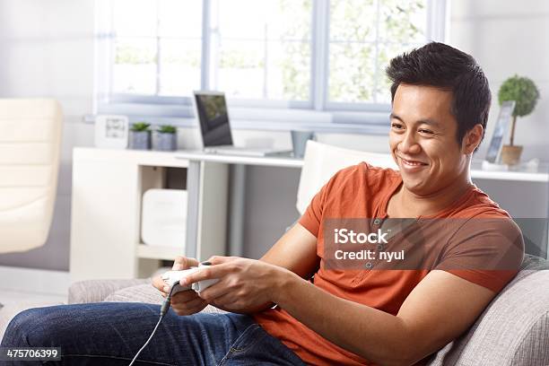 Playing Video Game Stock Photo - Download Image Now - 20-29 Years, 25-29 Years, Adult