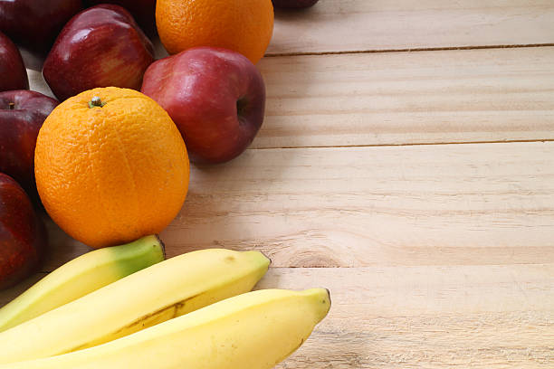 istock Fresh fruits on the old wooden board 475706802