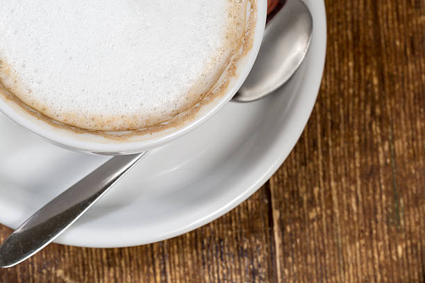 istock Close up cup of coffee on the wooden table 475706882