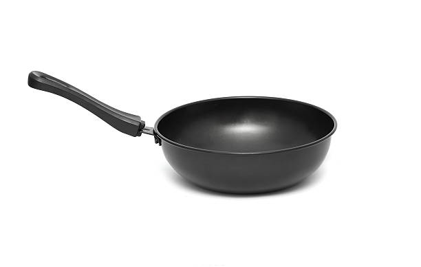istock pan black frying isolated on white background 475709769