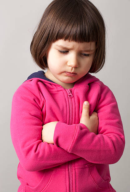 istock displeased preschool child with folded arms for irritation 475709998