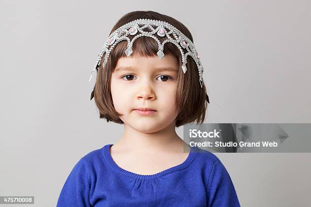 Adorable Young Girl With Crown Upside Down On Her Head Stock Photo - Download Image Now