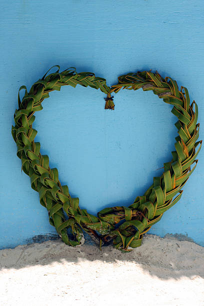 Heart made of palm leaves stock photo