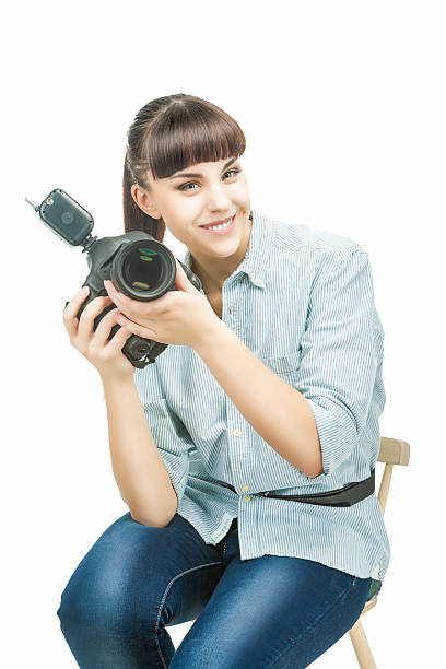istock Female Photographer Holding a Camera and Smiling 475710675
