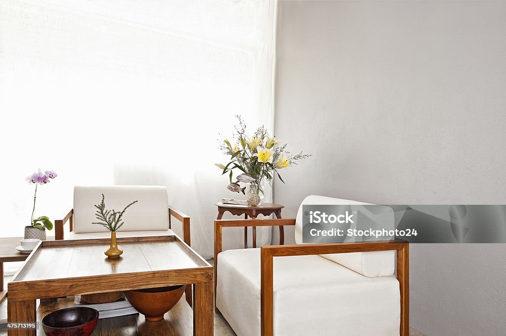 Bright white seater in lounge area Bright white seater in lounge area with coffee table Beige Stock Photo