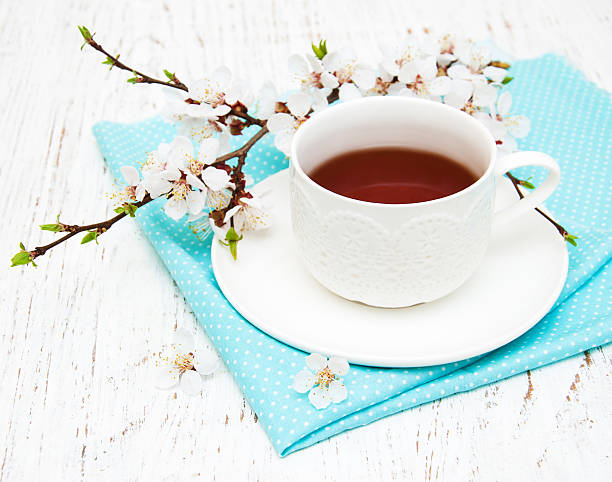 istock Cup of tea and spring blossom 475713420