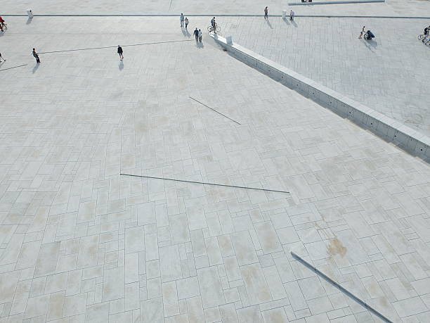 An aerial photo of a crowd of people from the top of the Oslo Opera House, Norway.