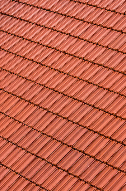 istock Red tiles roof background 475715196