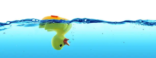 rubber duck sinking in water -  failure and SOS concept