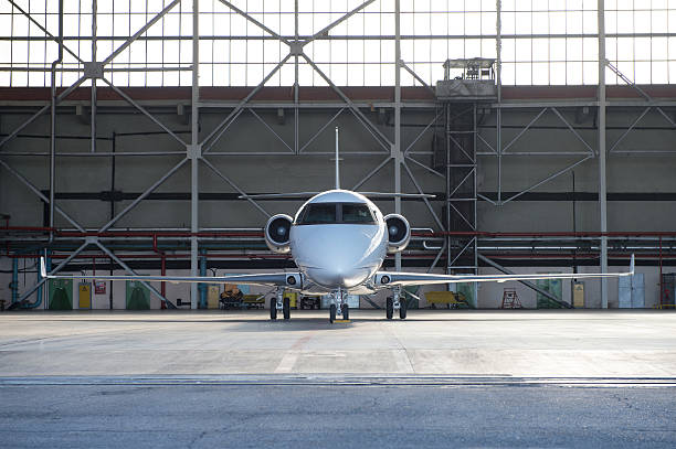 istock Business jet airplane is in hangar. 475716218