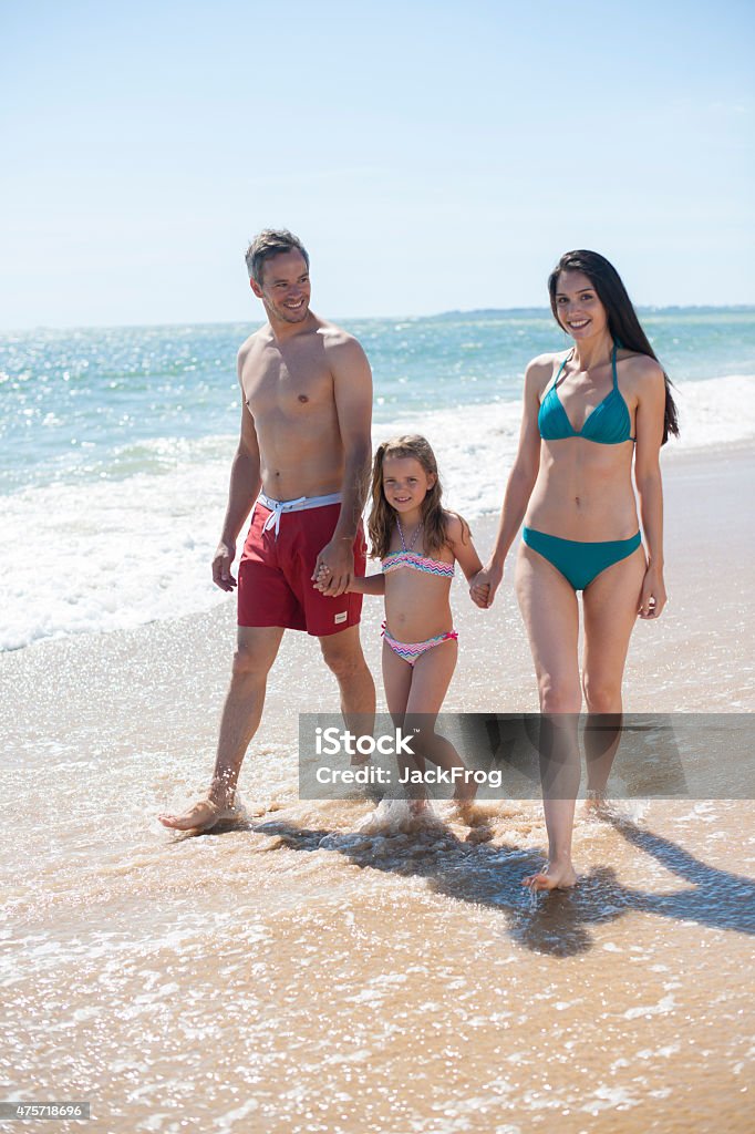 Nice Family In Swimsuit Walking On The Beach Stock Photo - Download Image  Now - 2015, 6-7 Years, Adult - iStock