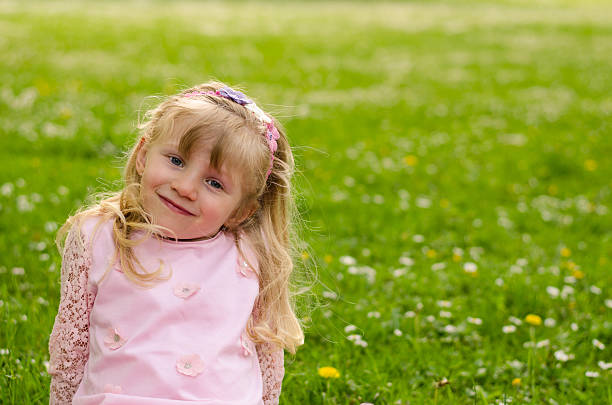 istock blond girl in meadow 475718704