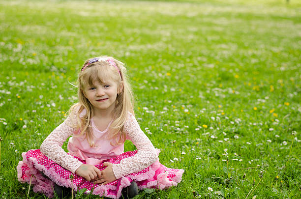 istock blond girl in meadow 475718716