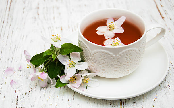 istock Cup of tea and spring blossom 475718988