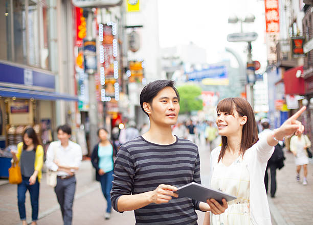 istock Young couple pointing and looking out 475719170
