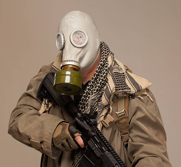 istock Doomsday man with rifle and gas mask. 475722406